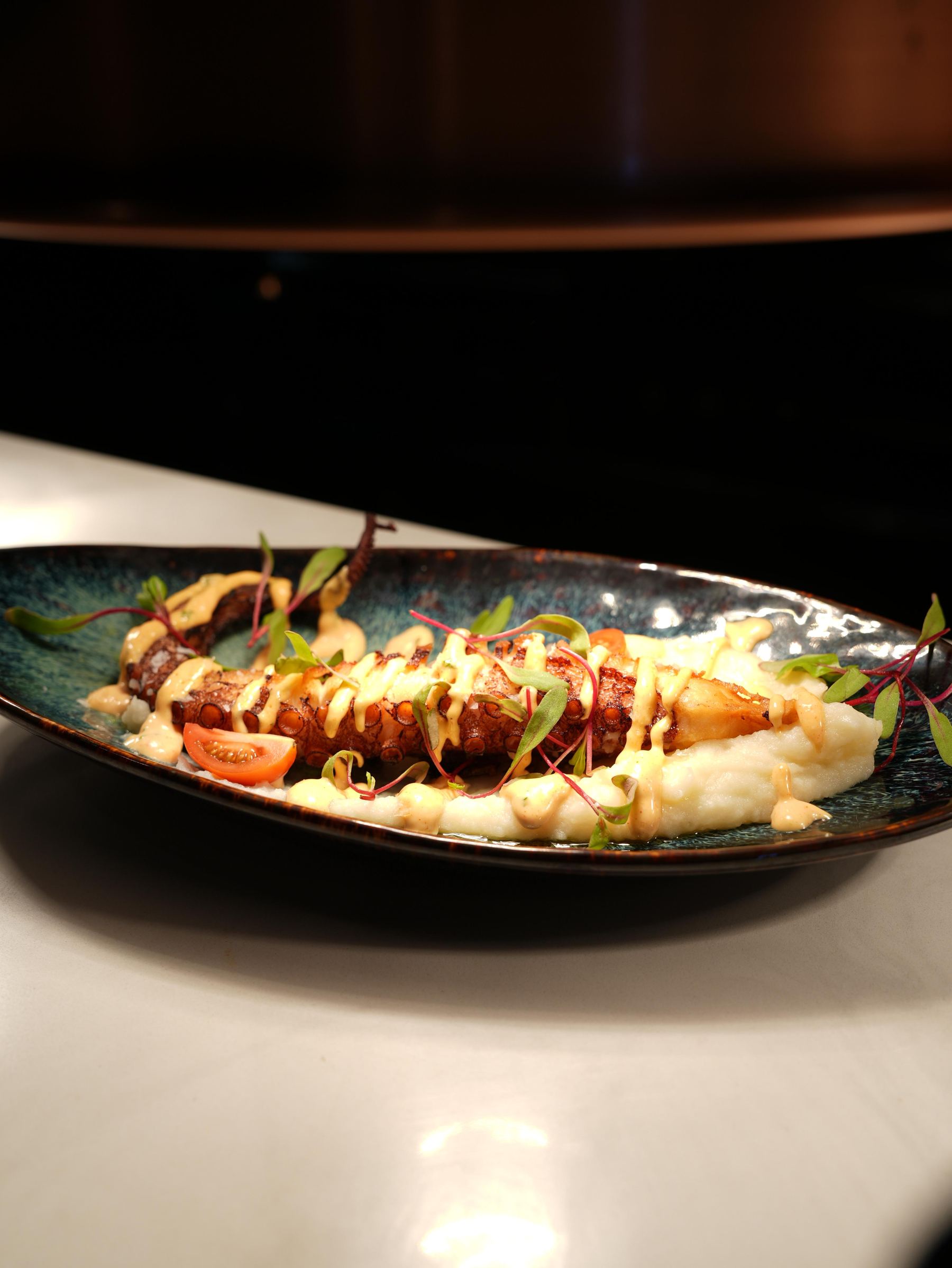 Grilled octopus over mashed potato with paprika aioli at Madrid Tapas y Vinos